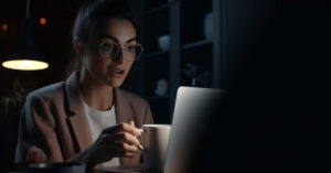 young woman in front of computer